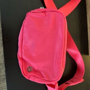 Lululemon Athletica Pink Crossbody Bag with Vibrant Color and Compact Design